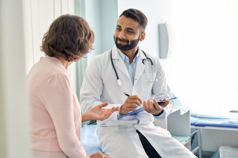 Bariatric Surgery in 2025: How BLISCare Helps Surgeons Outperform GLP-1 Weight Loss Trends Indian Male Doctor Physician Consulting Senior Patient Filling Medical Form. Bariatric Surgery in 2025: How BLISCare Helps Surgeons Outperform GLP-1 Weight Loss Trends