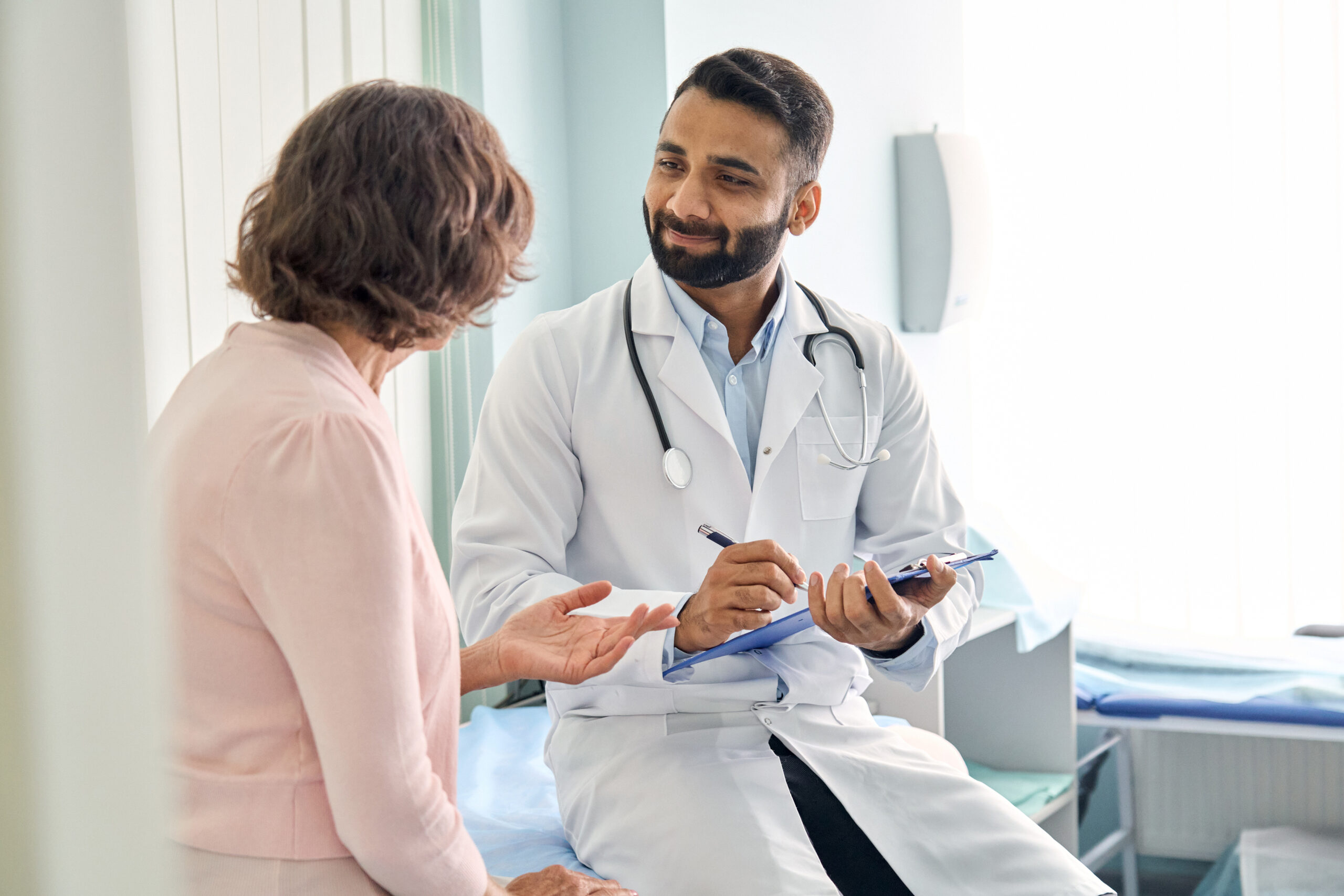 Bariatric Surgery in 2025: How BLISCare Helps Surgeons Outperform GLP-1 Weight Loss Trends Indian Male Doctor Physician Consulting Senior Patient Filling Medical Form. Bariatric Surgery in 2025: How BLISCare Helps Surgeons Outperform GLP-1 Weight Loss Trends